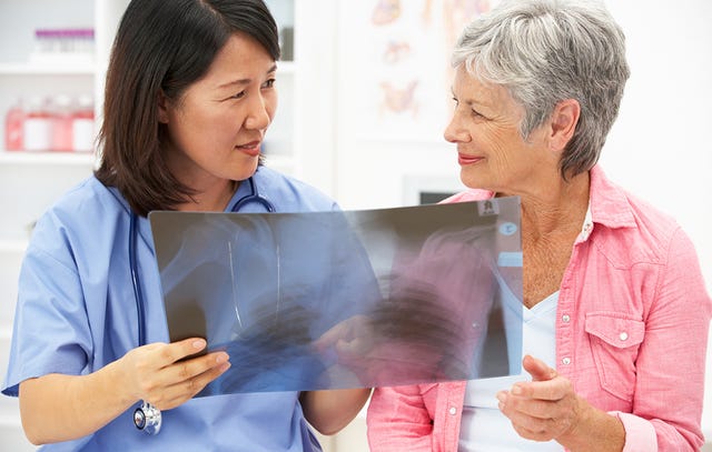 nurse looking at xray