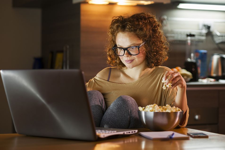 woman working on laptop with coffee