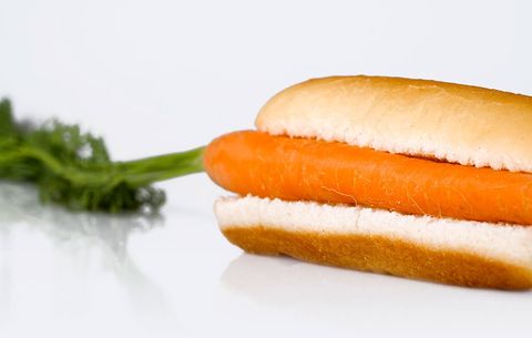 a carrot on a hot dog bun