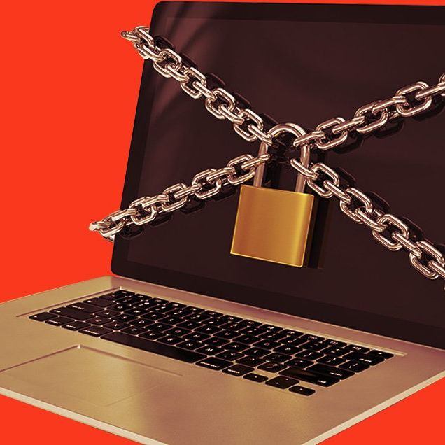 Padlock and chain on laptop computer