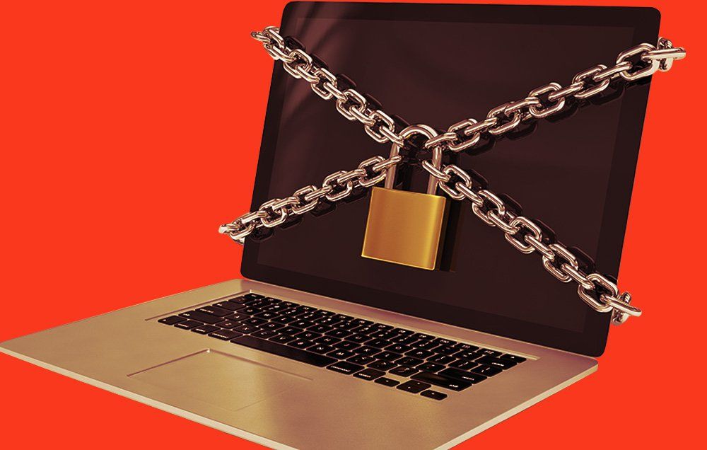 Padlock and chain on laptop computer