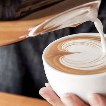 milk pouring into coffee
