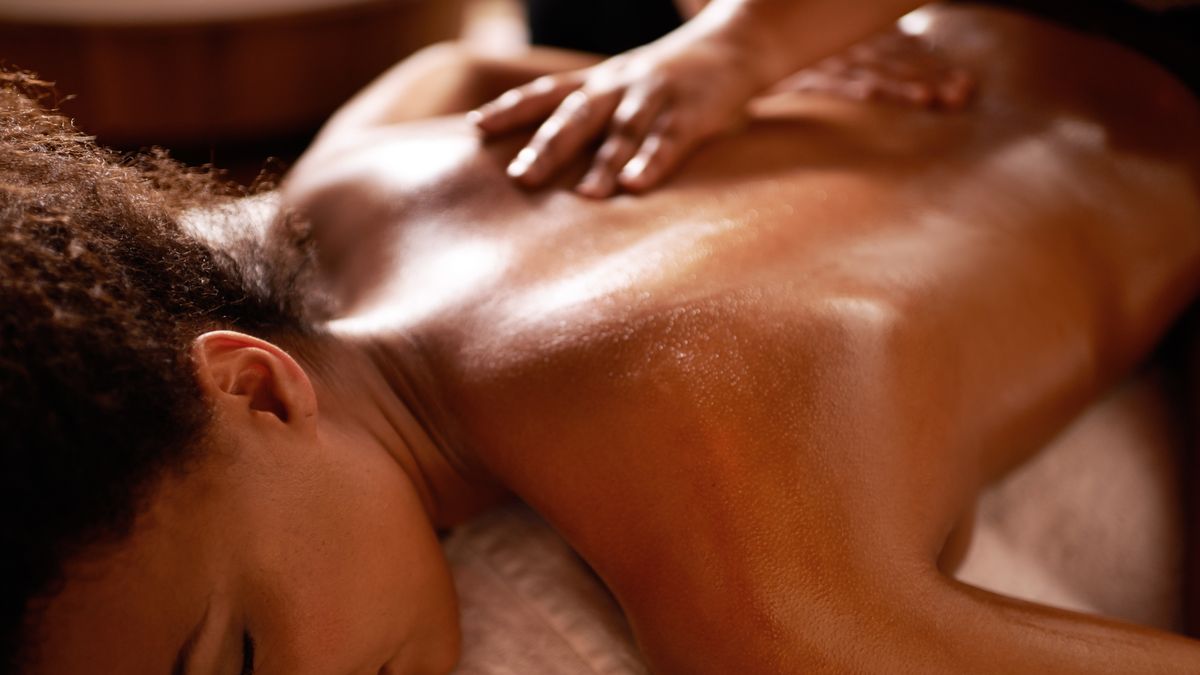 Woman Having Neck and Shoulder Massage in Spa Center Stock Photo