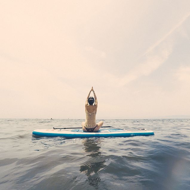 Why Stand Up Paddle Board Yoga Is The Best Summer Workout - Camille Styles