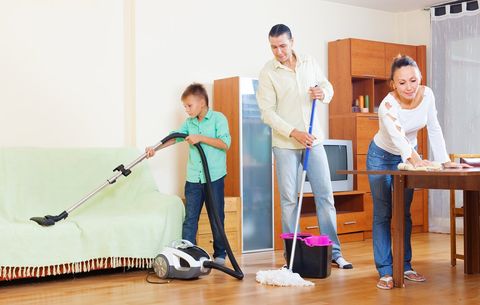 Family cleaning the house together
