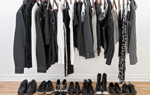 Organized hall closet with clothing and shoes