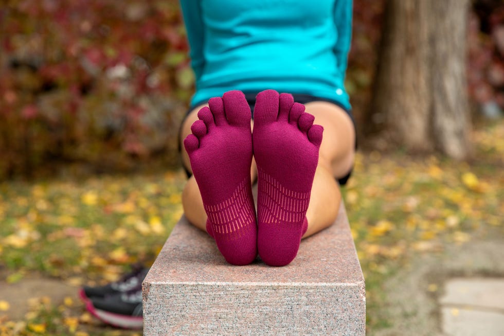 a person wearing purple socks