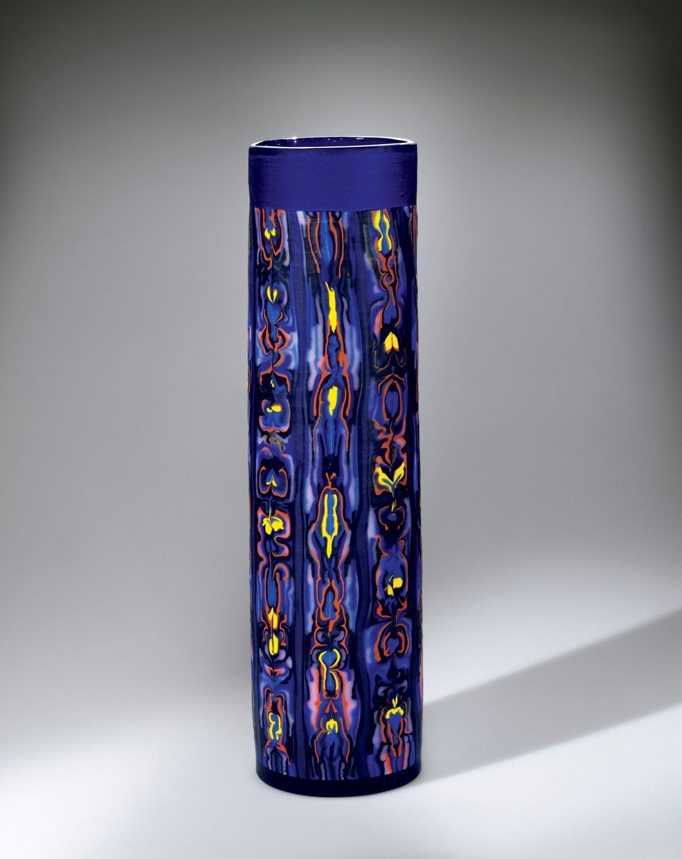 Ceramic vase with vibrant patterns and colors.