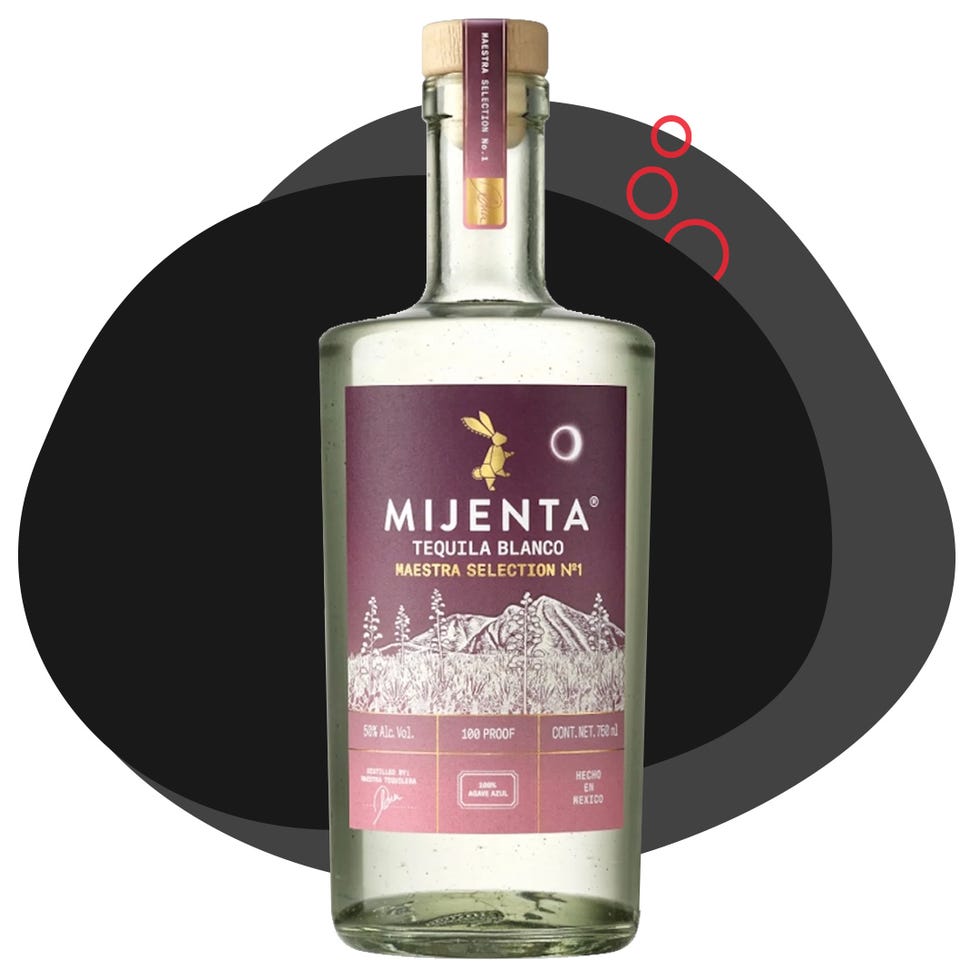 bottle of mijenta tequila blanco with a dark background