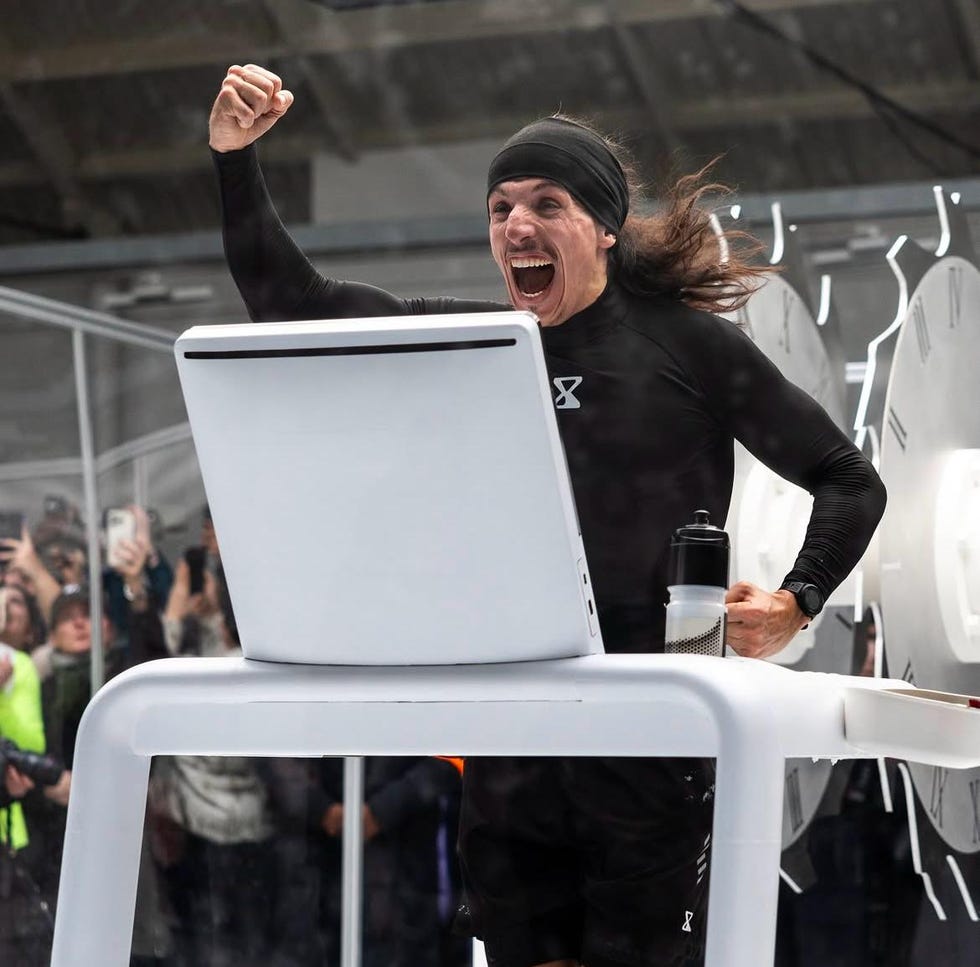 person celebrating in front of a large display