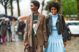 two women walking outside during paris fashion week 2022