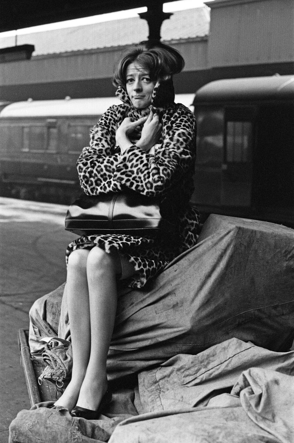 maggie smith pictured on a train station platform as she waits for a train from london to newcastle upon tyne to rehearse with sir laurence olivier for the national theatre's production of othello which will be in birmingham 24th march 1964