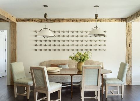 dining room with wood beams
