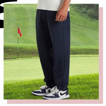 a person standing on a golf course