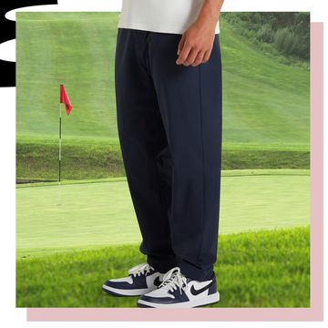 a person standing on a golf course