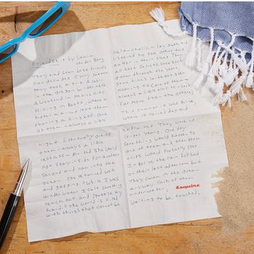a notebook with a pen and a pencil on a table