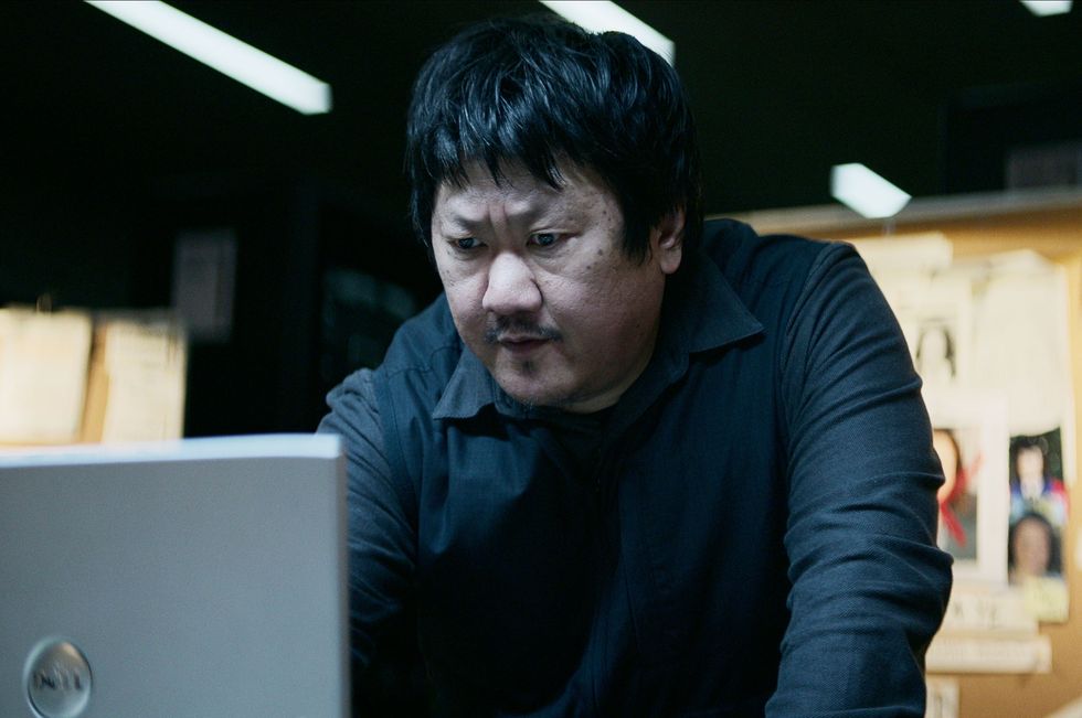 a man looking at a computer