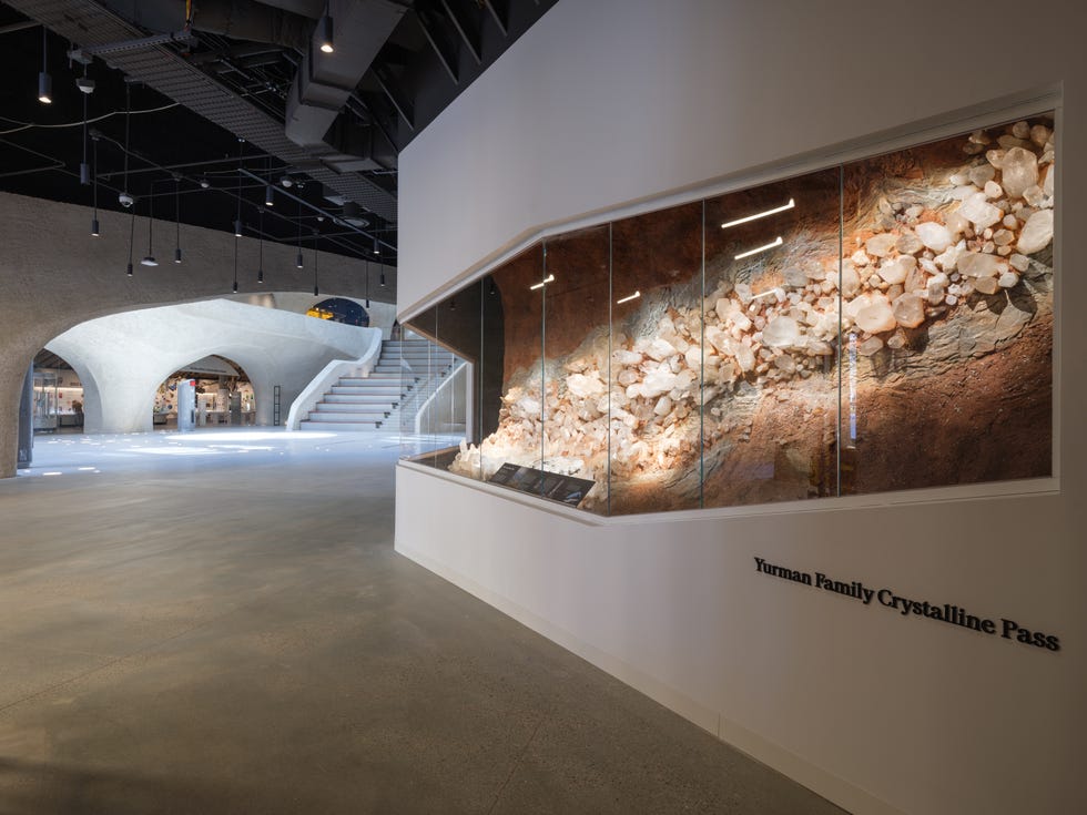 wide shot of kenneth c griffin exploration with david yurman crystalline pass in foreground entrance to gilder center from halls of gems and minerals