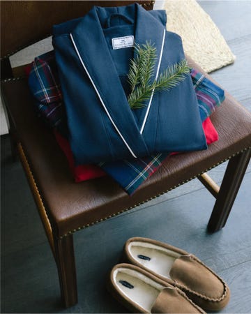 stack of clothing and slippers on a chair