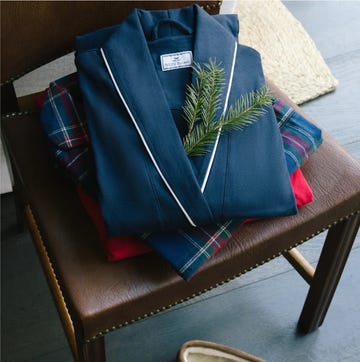 stack of clothing and slippers on a chair stack of clothing and slippers on a chair