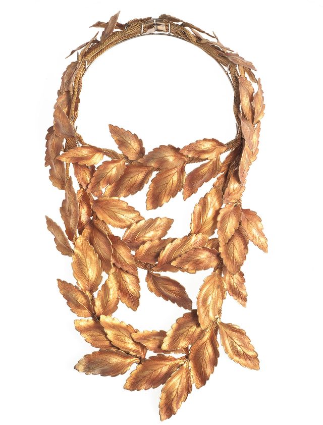a necklace made of individual gold leaves designed by elsa schiaparelli