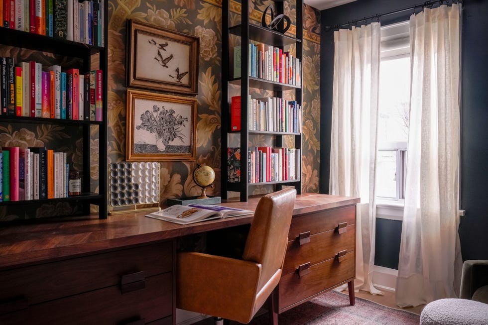 desk with bookshelf and clock