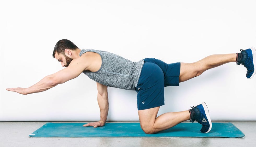 a person performing a workout exercise on a mat