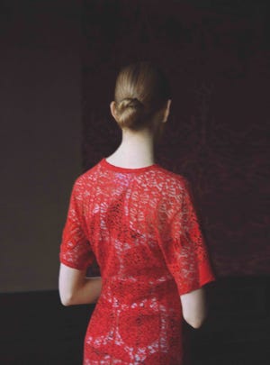 rear view of model standing with her back to the camera, top half seen only, wearing a cotton and lace dress, £1,895 stella mccartney