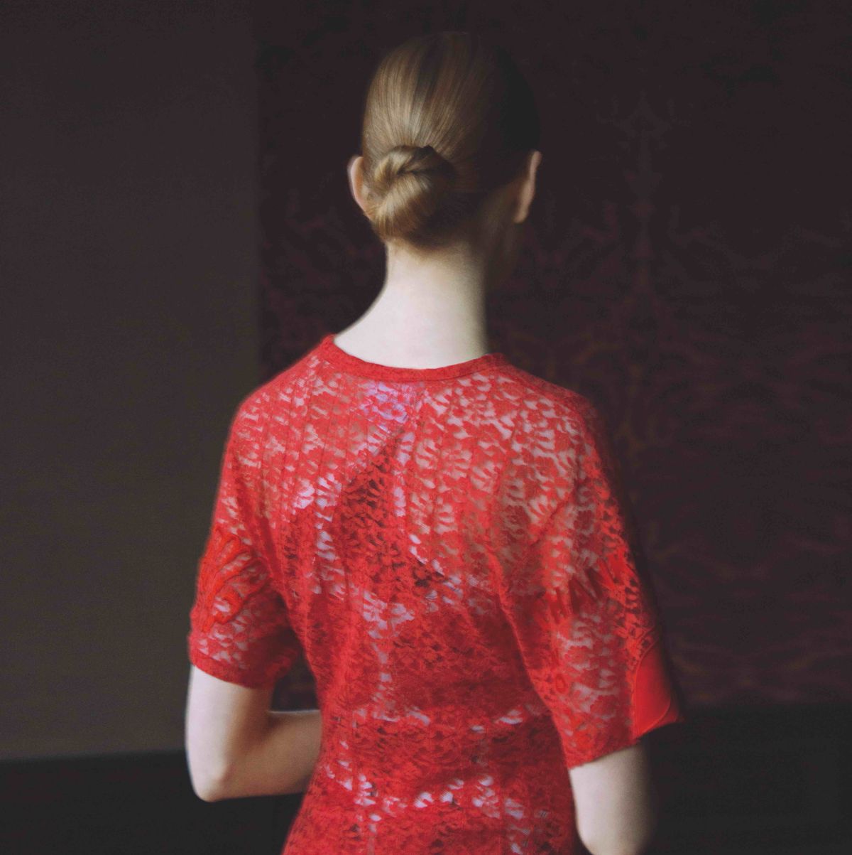 rear view of model standing with her back to the camera, top half seen only, wearing a cotton and lace dress, £1,895 stella mccartney