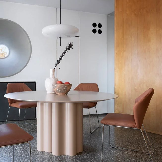 a table with chairs and a lamp a table with chairs and a lamp