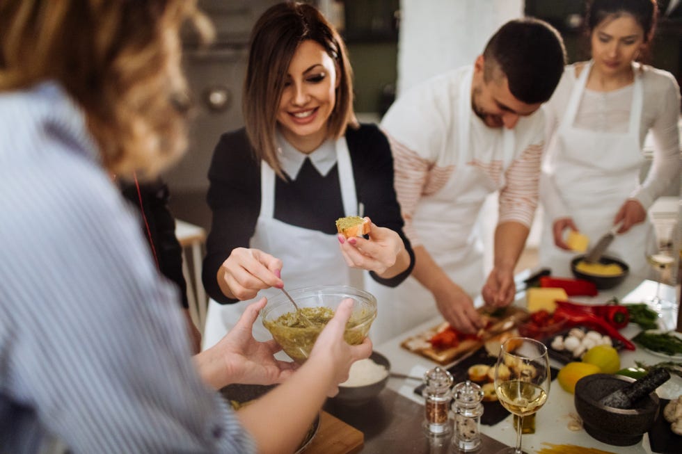 a group of people cooking together