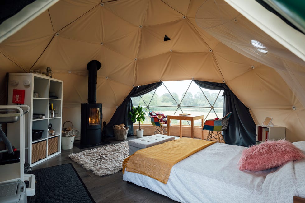 interior of the living space of a space age style dome tent at a glamping site in northumberland
