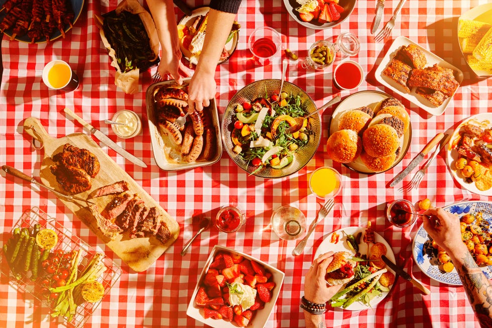 overhead shot of food spread out on a picnic blanket