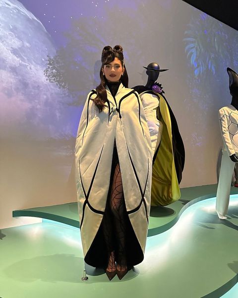 kylie jenner poses in museum exhibit