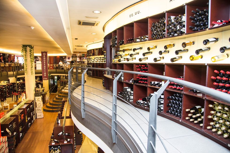a large room with shelves of wine