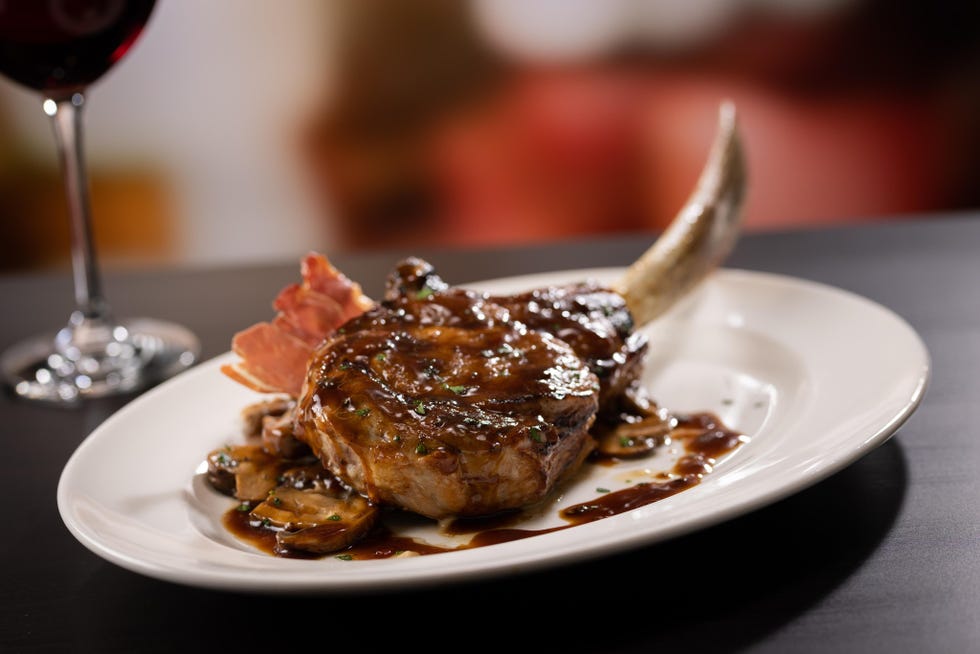bone in tomahawk veal chop on plate
