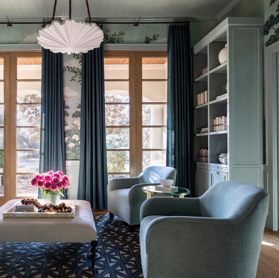 living room, blue sofa, blue lounge chairs, white pendant