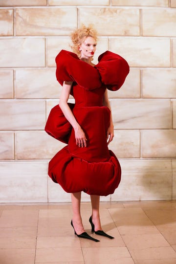 Stylish red dress with exaggerated puffed sleeves and skirt