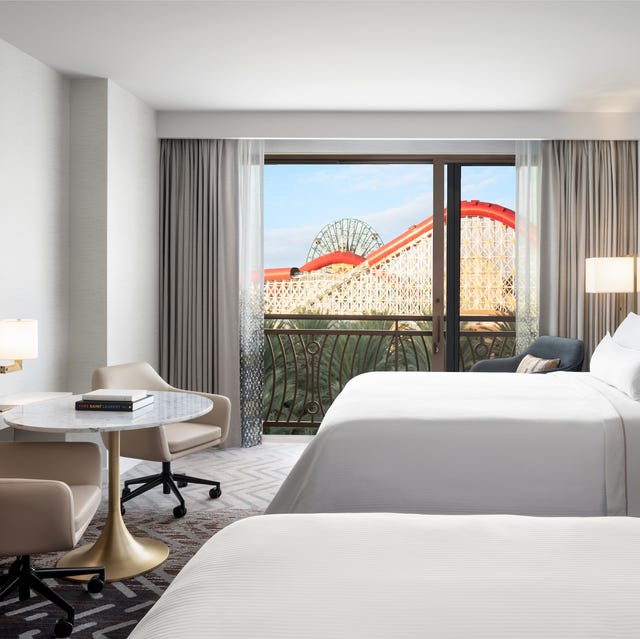 a bedroom with a large window a bedroom with a large window
