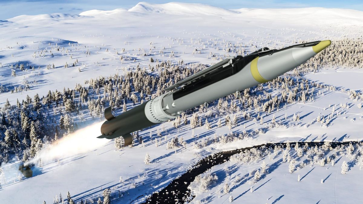ground launched small diameter bomb in black and yellow flying over wintry forest