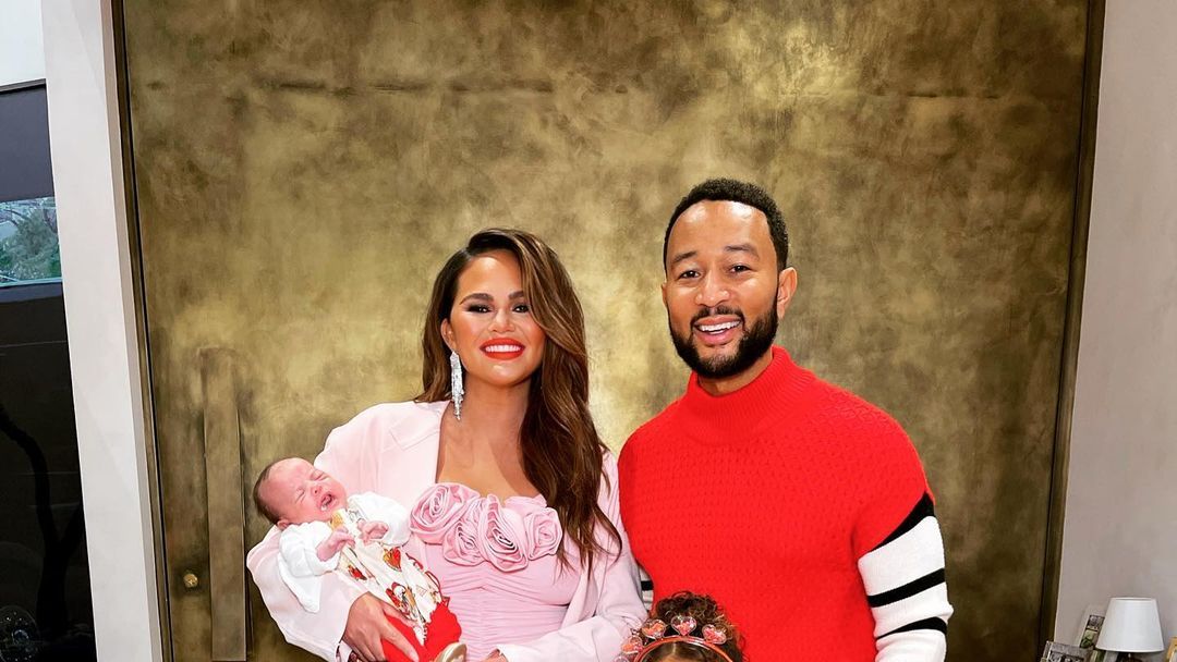 Chrissy Teigen and John Legend Coordinated in Red and Pink for ...