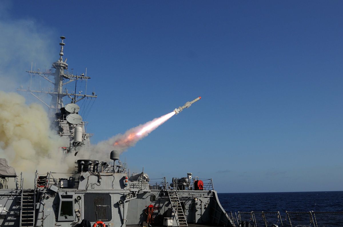 the guided missile destroyer uss mitscher launches a harpoon anti ship missile at the ex usns saturn during a sinking exercise mitscher and other ships assigned to the george hw bush carrier strike group fired live ammunition at saturn