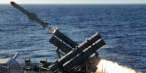 the guided missile cruiser uss gettysburg fires a harpoon anti ship missile at the ex usns saturn during a sinking exercise gettysburg and other ships assigned to the george hw bush carrier strike group fired live ammunition at saturn