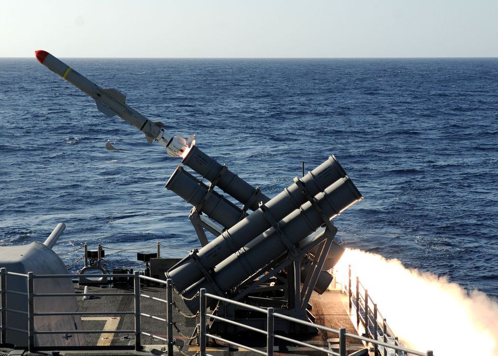 the guided missile cruiser uss gettysburg fires a harpoon anti ship missile at the ex usns saturn during a sinking exercise gettysburg and other ships assigned to the george hw bush carrier strike group fired live ammunition at saturn