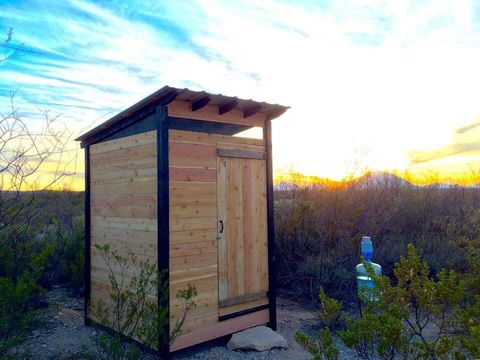 outhouse with a compost toilet