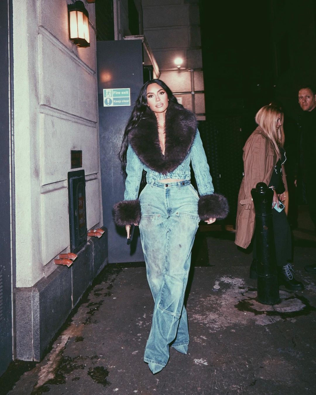 Kim Kardashian Parties in a Denim Suit with Fur in London