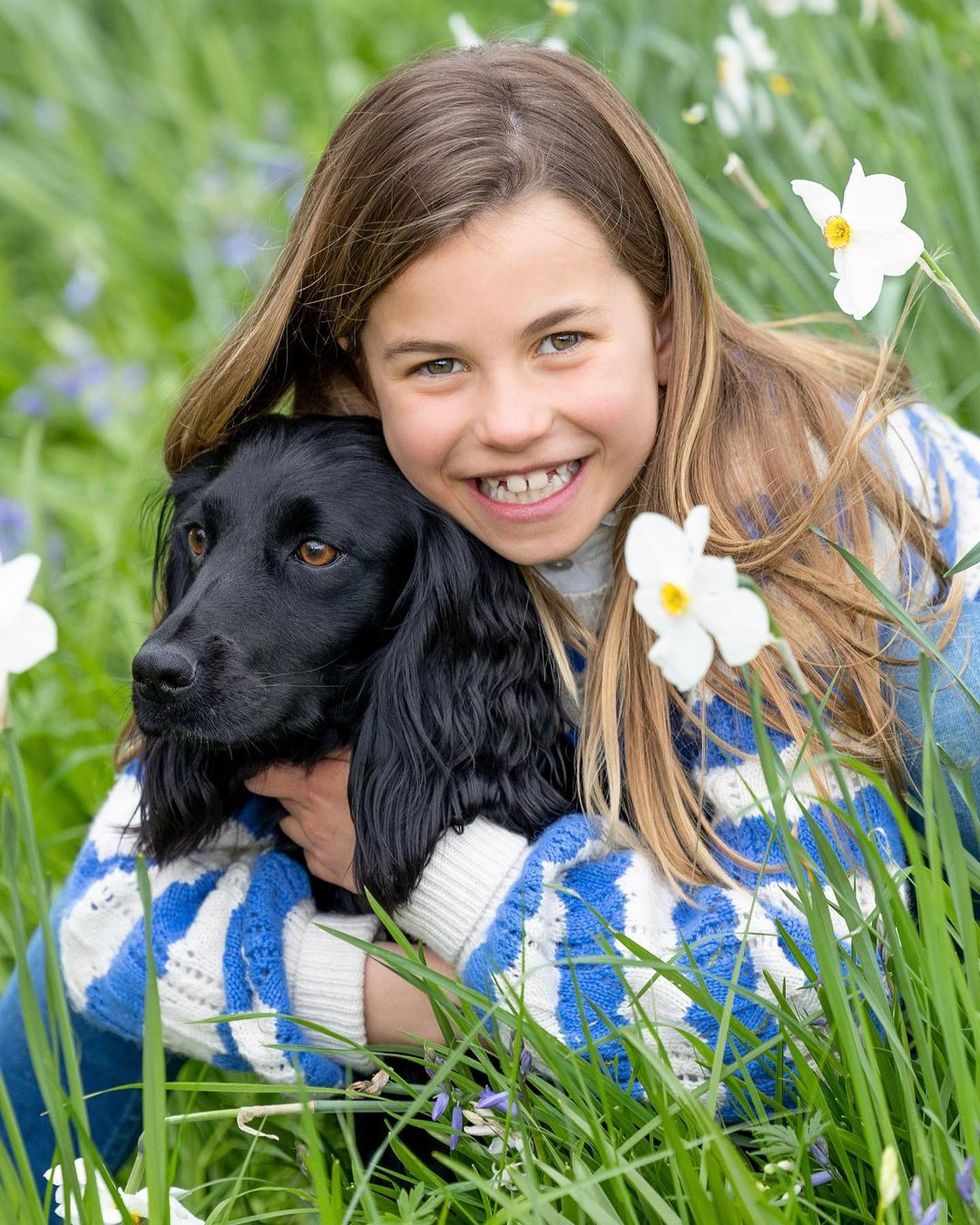 princess charlotte holding a dog, named aura