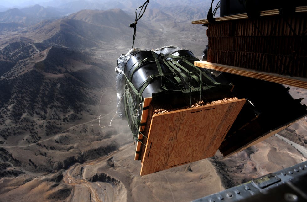 forty bundles of fuel fly out the back of a us air force globemaster iii aircraft assigned to the 816th expeditionary airlift squadron, during an air drop mission over afghanistan in support of operation enduring freedom on dec 8, 2010 us air force photo by staff sgt andy m kin released