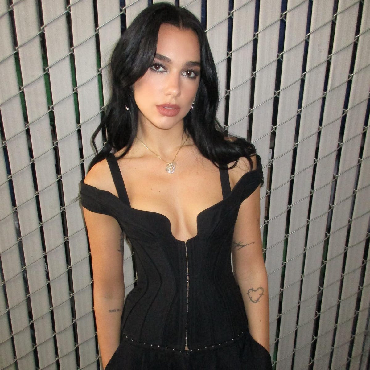 Dua Lipa Looks So Sophisticated In A Plunging Backless Minidress 