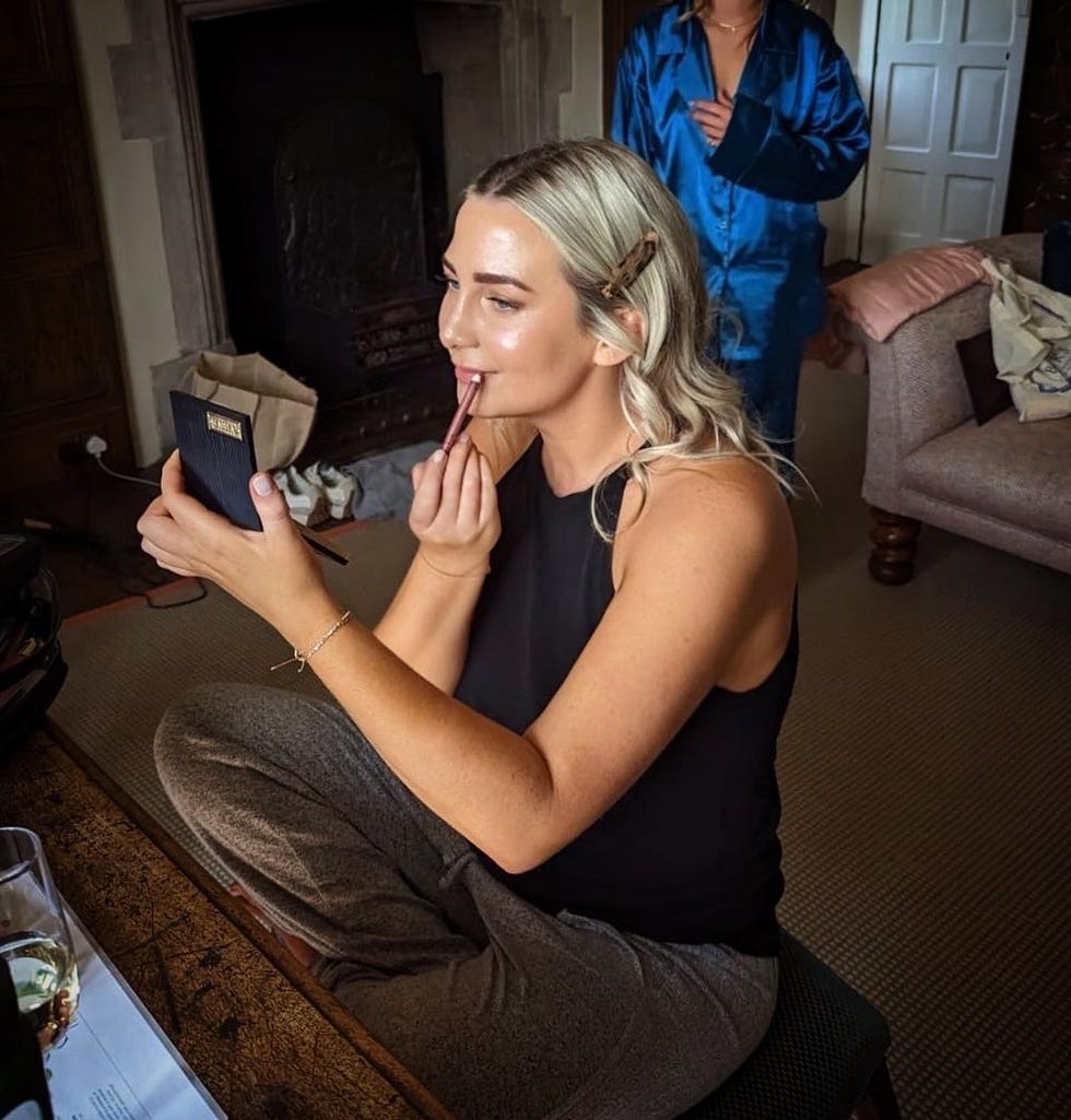 a woman sitting on a couch